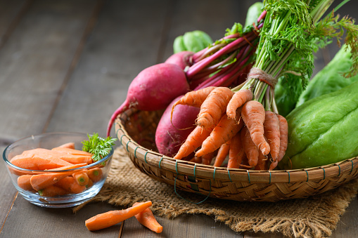 Healthy vegetables on basket, baby carrots and radish, High in calcium, phosphorus and carbohydrates
