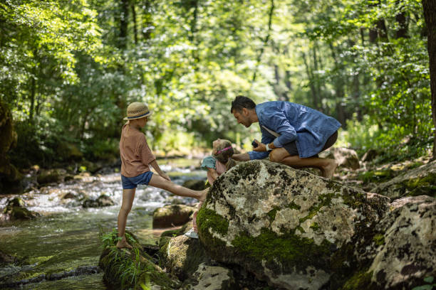 istock Happy family having fun in nature 1445191396