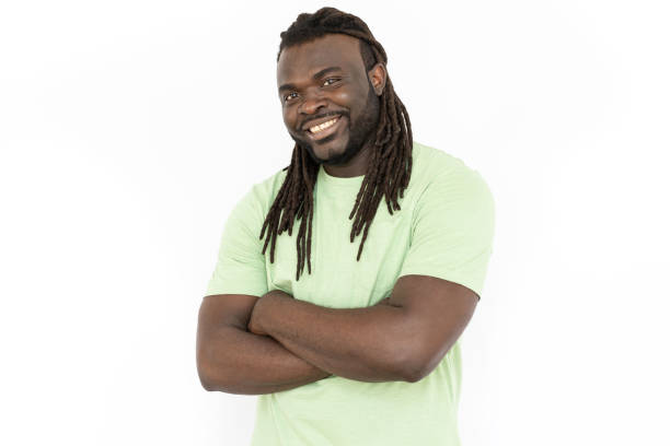 istock Happy African American standing with folded arms and smiling 1445192085