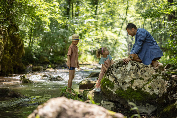 istock Happy family having fun in nature 1445192796