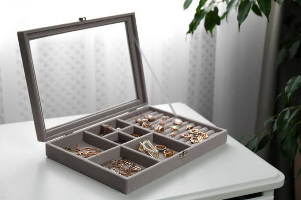 istock Elegant jewelry box with beautiful bijouterie on white table in room 1445192914