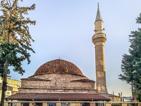 Antalya, Turkey - October 26, 2019: Ancient Balibey Mosque with one minaret and tiled dome in Antalya. Antique muslim architecture in turkish city