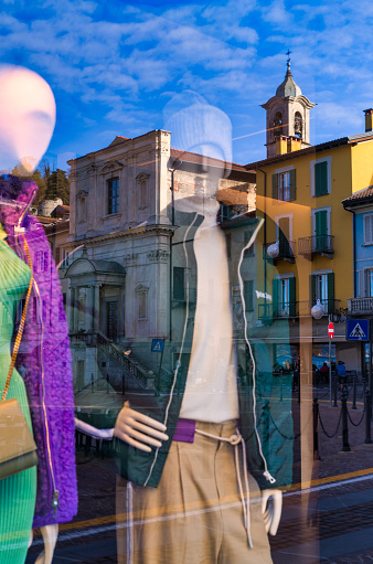 Arona reflected in a clothing store