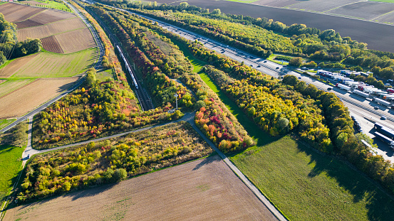 German highway and highspeed train railroad track - aerial view