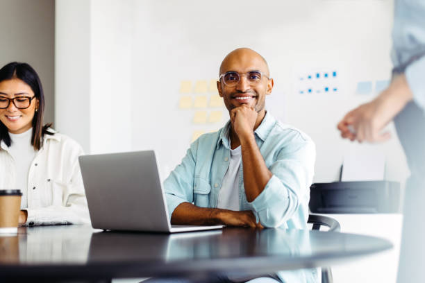 istock Male designer sitting in a team meeting 1445195178