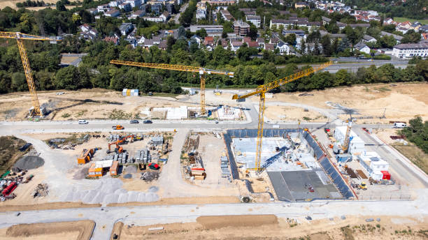 istock Large construction site, cranes and equipment - aerial view 1445195268