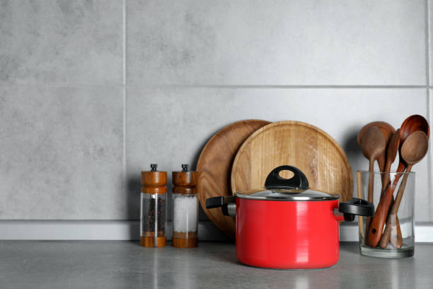 istock Set of different cooking utensils on grey countertop in kitchen. Space for text 1445196945