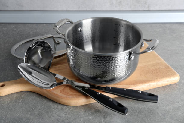 istock Set of different cooking utensils on grey countertop in kitchen 1445196998
