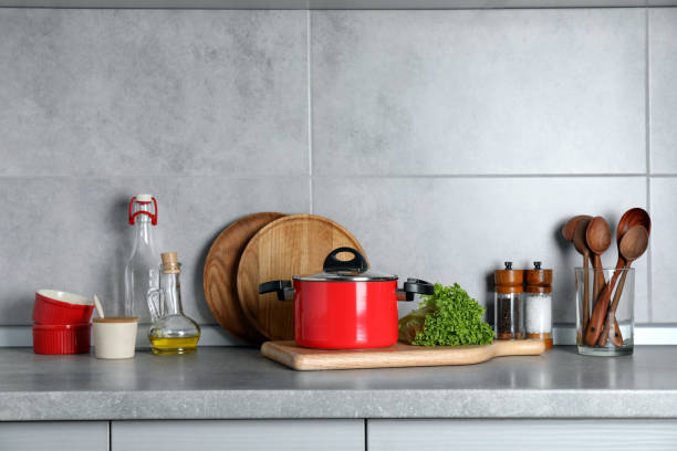 istock Set of different cooking utensils and products on grey countertop in kitchen 1445197072