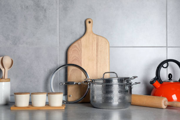 istock Set of different cooking utensils on grey countertop in kitchen 1445197073