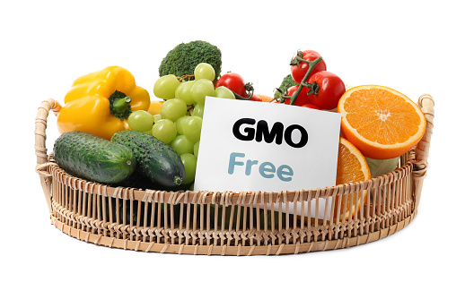 Tasty fresh GMO free products and paper card on white background