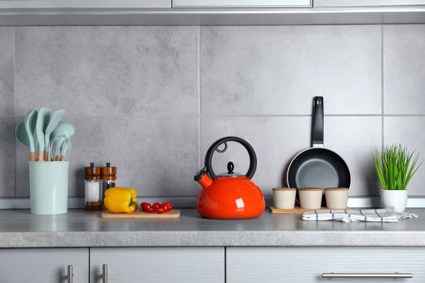 istock Set of different cooking utensils and products on grey countertop in kitchen 1445197406
