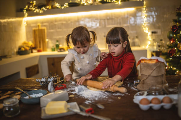 istock Girls baking christmas cookies 1445198117