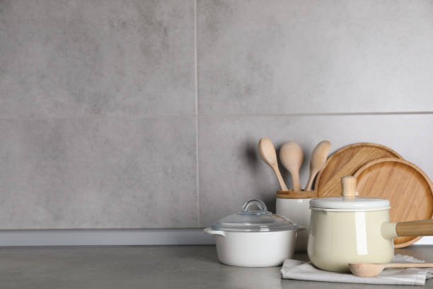 istock Set of different cooking utensils on grey countertop in kitchen. Space for text 1445198223