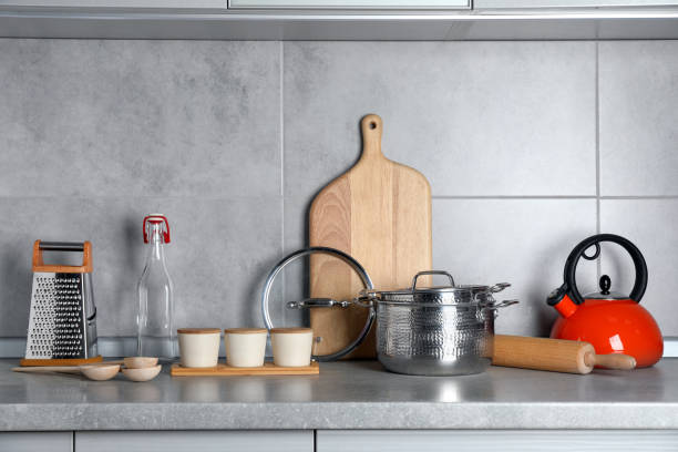 istock Set of different cooking utensils on grey countertop in kitchen 1445198224