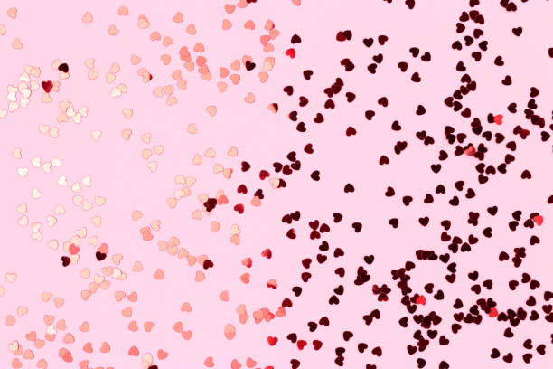 istock Metallic red confetti in a heart shaped. 1445201102