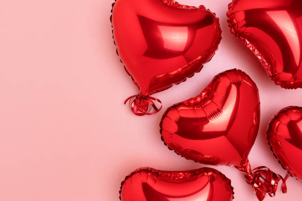 istock Red inflatable foil balloons in a heart shape. 1445201155