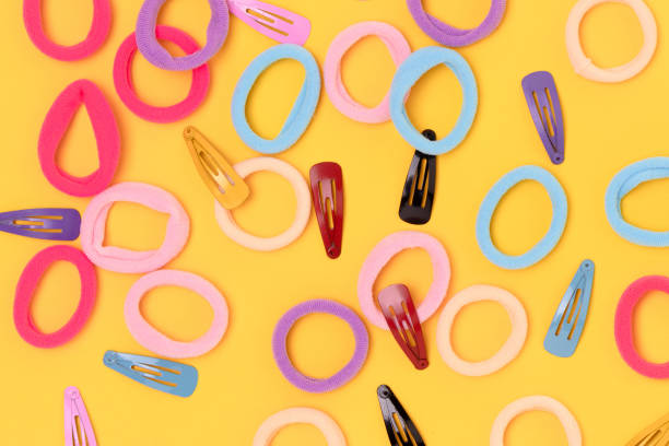 Many small multicolored hair scrunchies and clips.