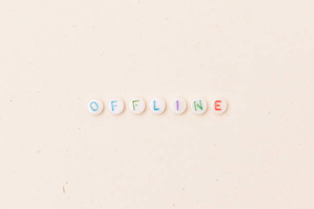 istock Word Offline. Quote made of white round beads with multicolored letters. 1445201768