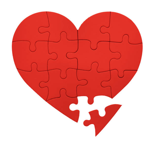 istock Final piece of the romantic puzzle: heart-shaped jigsaw in bright red 1445202183