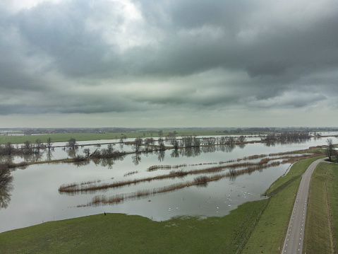 High water level on the floodplains of the river IJssel near the city of Zwolle in Overijssel, The Netherlands. Aerial drone point of view.