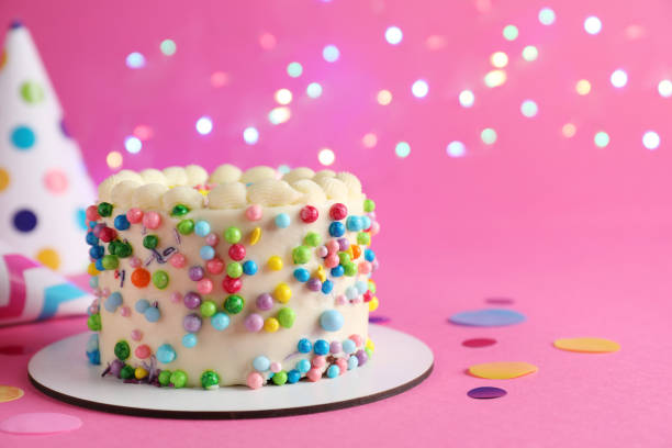 istock Cute bento cake with tasty cream and decor on pink background, space for text 1445202911