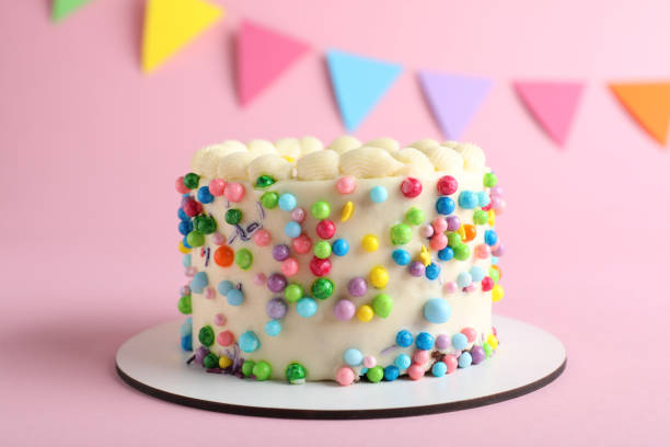 istock Cute bento cake with tasty cream on pink background 1445202913
