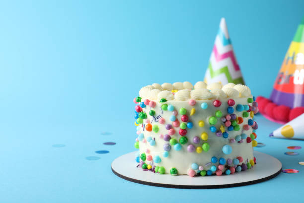 istock Cute bento cake with tasty cream on light blue background, space for text 1445203313