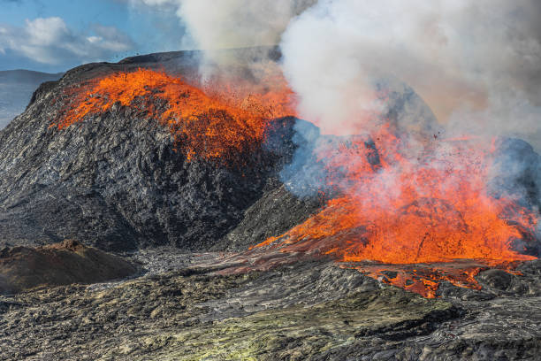 istock Volcanic crater with glowing hot lava 1445203583