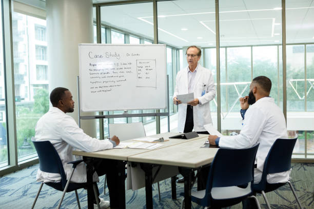 istock Healthcare administrative team meets 1445205284