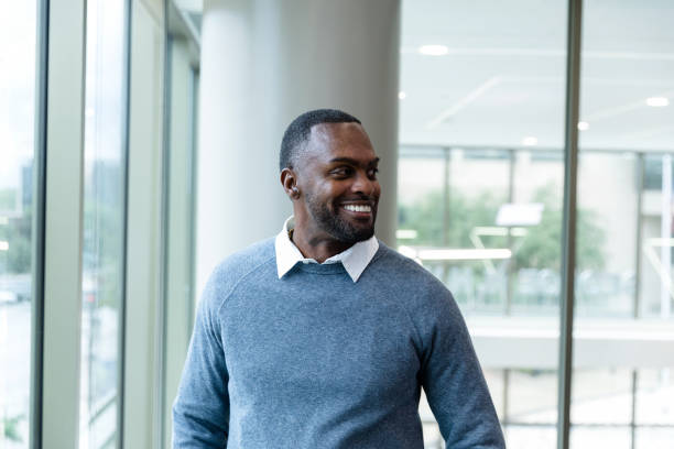 istock Pharmacy technician smiling at his peers 1445205347