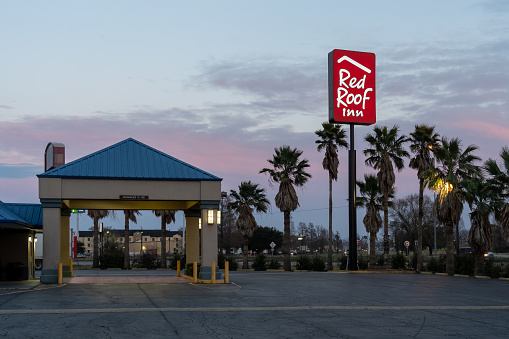 Baton Rouge,  Louisiana, USA- February 12, 2022: A Red Roof Inn in Baton Rouge,  Louisiana, USA. Red Roof Inn is an American economy hotel chain.