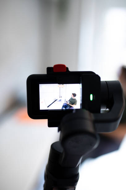 istock Male gamer recording playing video games 1445207007