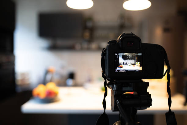 Preparing camera and kitchen for recording cooking Preparing camera and kitchen for recording cooking commercial kitchen photos stock pictures, royalty-free photos & images