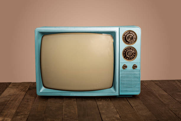 istock Old blue televisions on office table with side sliders and buttons 1445207494