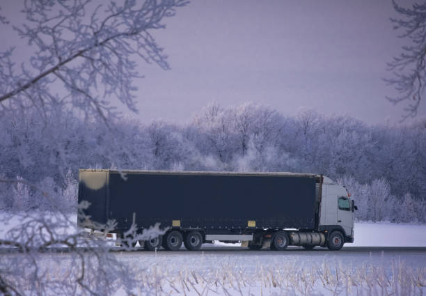 istock freight truck on winter road 1445208669