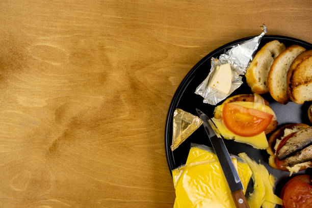 istock Plate with sandwiches, snacks on a plate on a wooden table, top view, space for text 1445208903