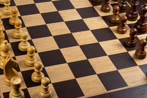 Chess board with figures, top view, business strategy and competition concept