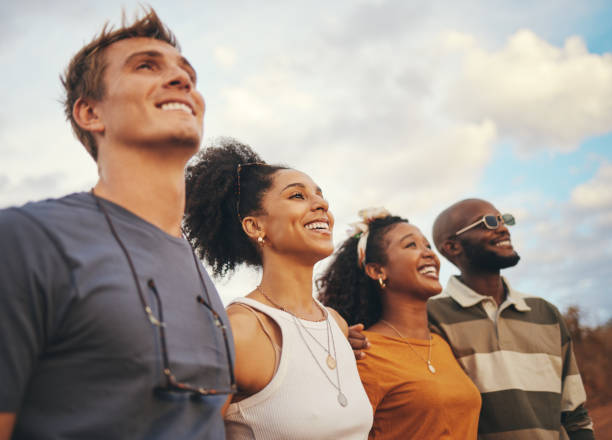istock Friends, diversity and smile with a happy group looking at the view while on holiday in nature during summer. Freedom, vacation and together with men and woman standing outdoor on a friend trip 1445210721