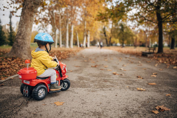 istock Little boy riding toy motorcycle 1445211743