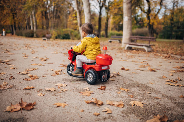 istock Little boy riding toy motorcycle 1445212620