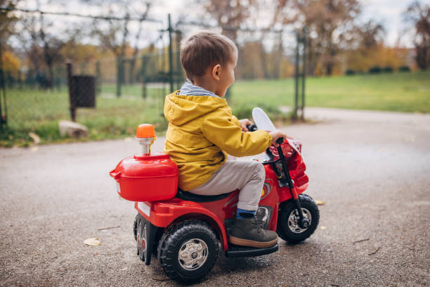 istock Little boy riding toy motorcycle 1445212789