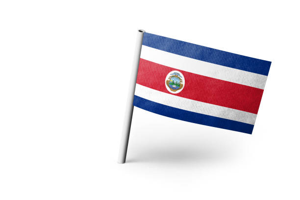 Small paper flag of Costa Rica pinned. Isolated on white background. Horizontal orientation. Close up photography. Copy space.