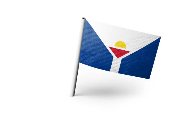 Small paper flag of Saint Martin pinned. Isolated on white background. Horizontal orientation. Close up photography. Copy space.