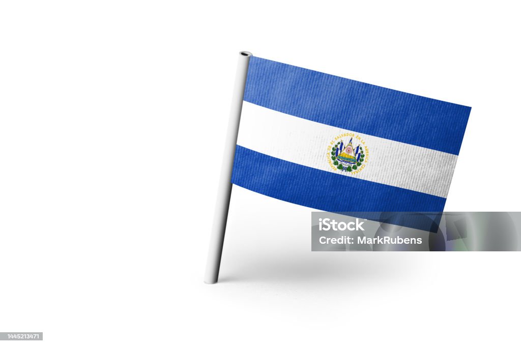 El Salvadoran flag pinned. White background. Small paper flag of El Salvador pinned. Isolated on white background. Horizontal orientation. Close up photography. Copy space. Close-up Stock Photo