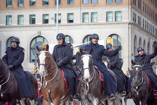 Toronto, Ontario, Canada- November 20th, 2022: Toronto mounted police in Toronto’s annual Santa Claus Parade.