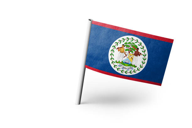 Small paper flag of Belize pinned. Isolated on white background. Horizontal orientation. Close up photography. Copy space.