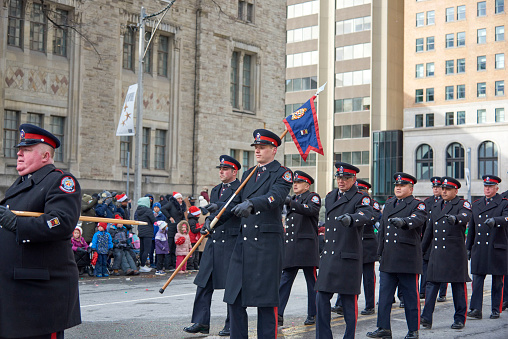 Toronto, Ontario, Canada- November 20th, 2022: Toronto police marching in Toronto’s annual Santa Claus Parade.
