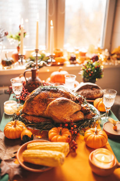 istock Thanksgiving holiday dinner table setting with fall decoration and pumpkins 1445213622