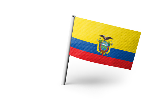 Small paper flag of Ecuador pinned. Isolated on white background. Horizontal orientation. Close up photography. Copy space.